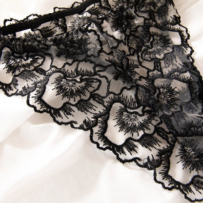 Black women's lace embroidered bikini set with steel rings and sheer construction