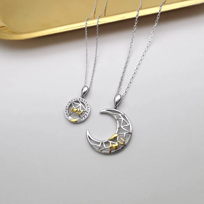 Sun and Moon copper couple's necklaces on a dark background, showing the detailed 4.5cm pendants and cross chain.