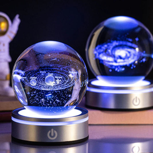 Luminous crystal ball with various celestial-inspired designs, including the Milky Way, Solar System, and Constellation.