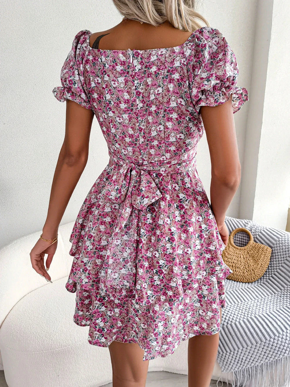 Stylish floral mini dress with ruffled skirt, high-waist design, and short sleeves for a flattering and comfortable summer look
