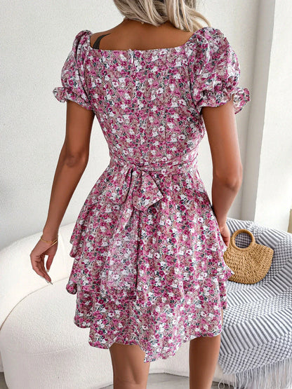 Stylish floral mini dress with ruffled skirt, high-waist design, and short sleeves for a flattering and comfortable summer look