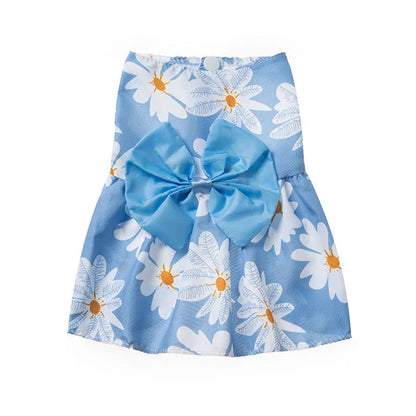 An orange floral butterfly knot princess dress for a small dog on a summer day.