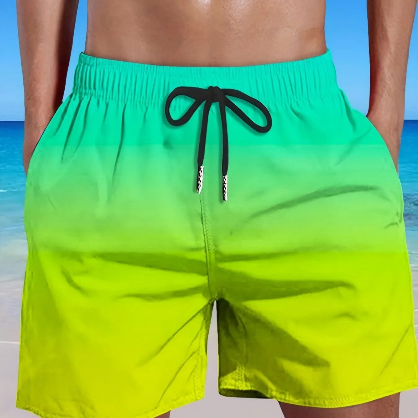 Men's grey gradient print sports shorts made from breathable mesh fabric, shown on a model.