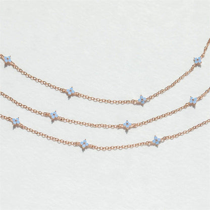 Elegant gold and silver floral necklace with adjustable chain and flower charm, perfect for vacation and beach outfits
