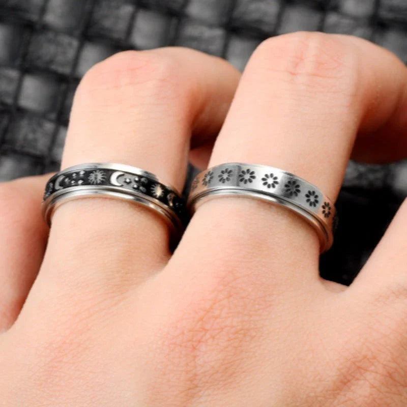 Rotatable stainless steel spinner ring with moon and star designs for anxiety relief and style