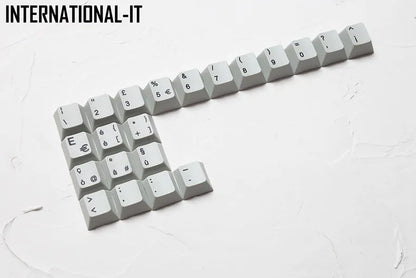Wired keyboard with international symbol keycaps for ten European language layouts showing USB and PS/2 connections