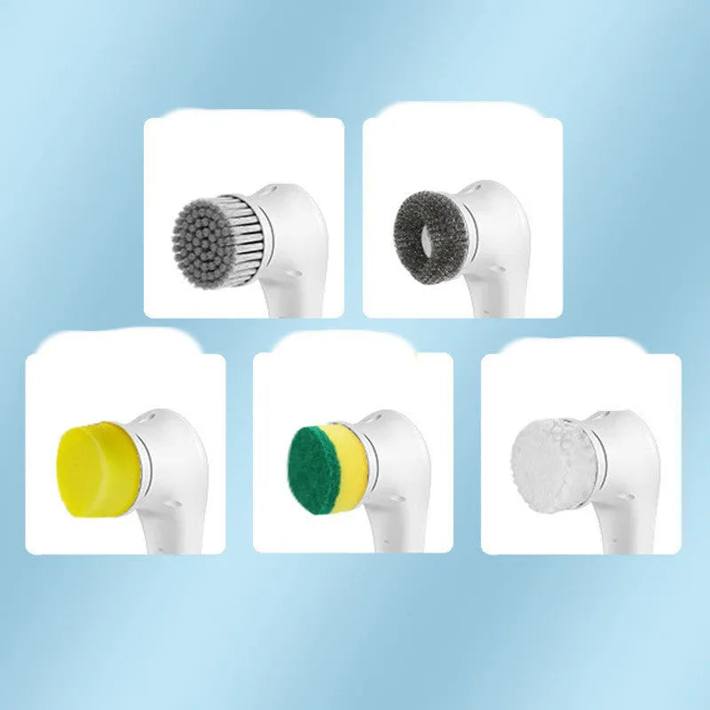 White cordless electric handheld scrubber with five attached brush heads on a kitchen counter