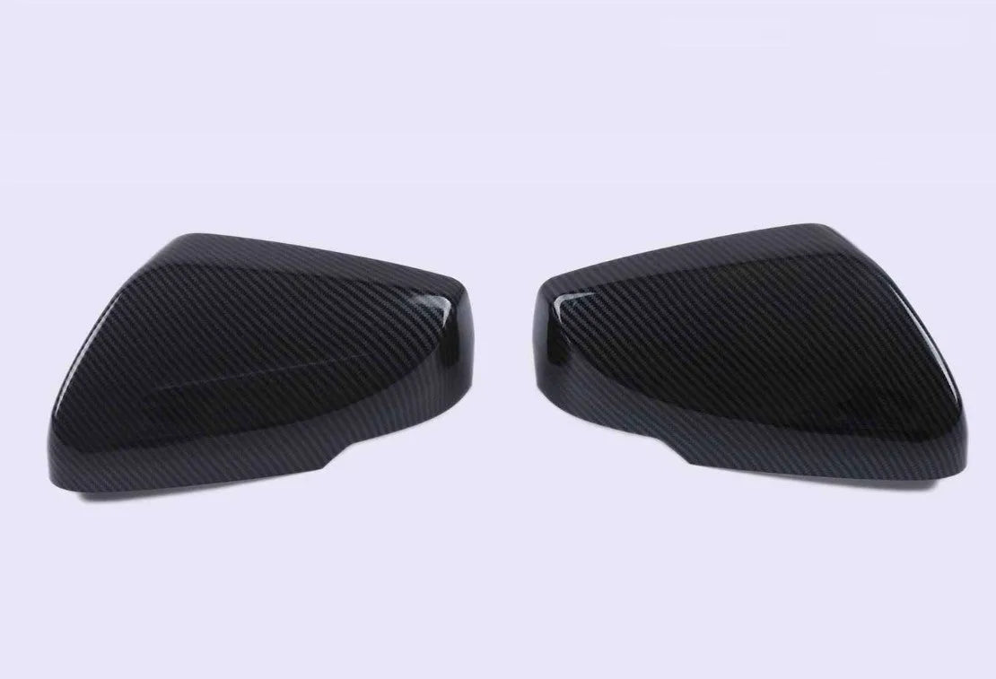 Pair of ABS plastic mirror covers for Cadillac CT5 CT6 in carbon fibre, silver, and rain frame finishes.
