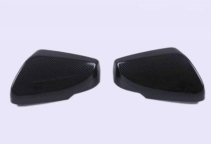 Pair of ABS plastic mirror covers for Cadillac CT5 CT6 in carbon fibre, silver, and rain frame finishes.