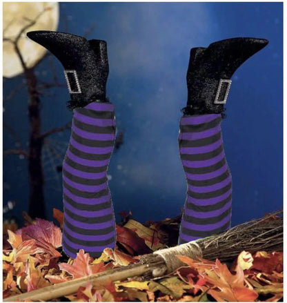 Halloween witch leg garden decoration with striped stockings and black boots