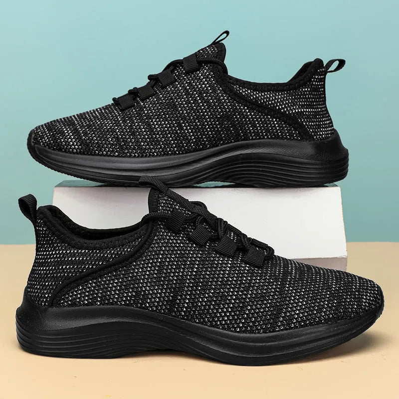 Women's black mesh casual sneakers with lace-up front and lightweight EVA sole