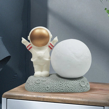 Astronaut-shaped night lamp with colour-changing LED and detachable design