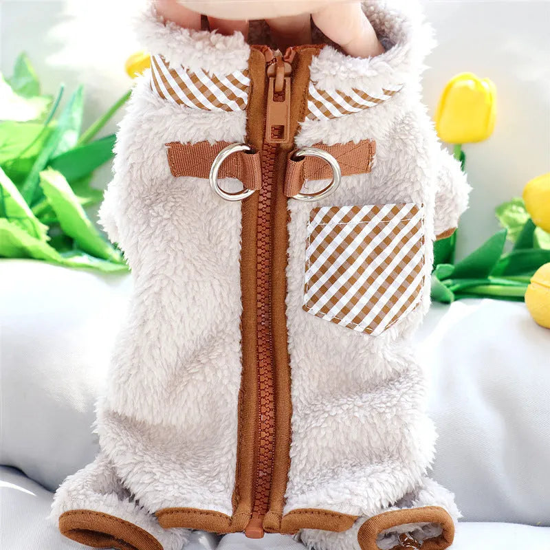 Green plush fleece dog jumpsuit on a small dog, showing the four-leg design and back zipper with D-ring.