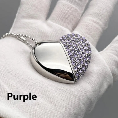 Blue heart-shaped USB flash drive with a brick-inlaid pattern on its metal surface.