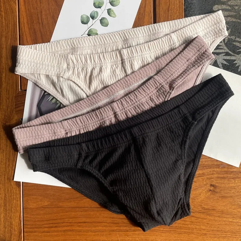 Men's solid colour pure cotton triangle underwear briefs on a mid-waist fit model