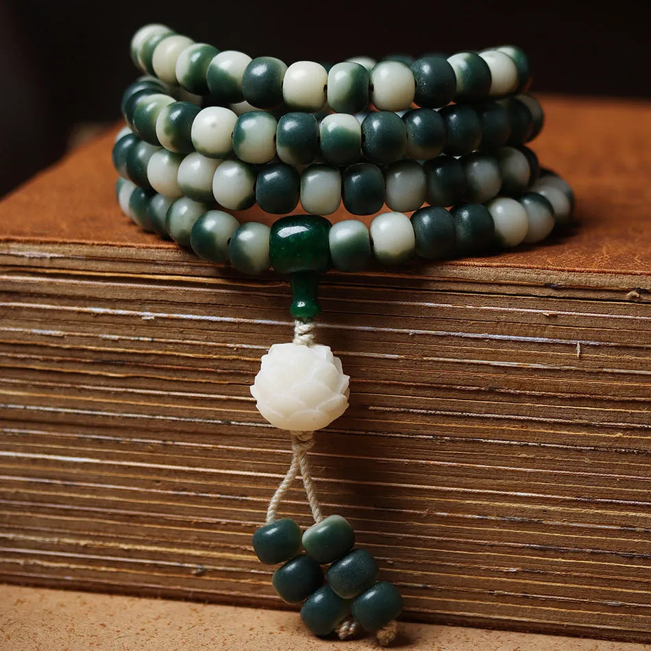Lotus white jade Bodhi root bracelet with floating flowers pattern on 8x10mm beads