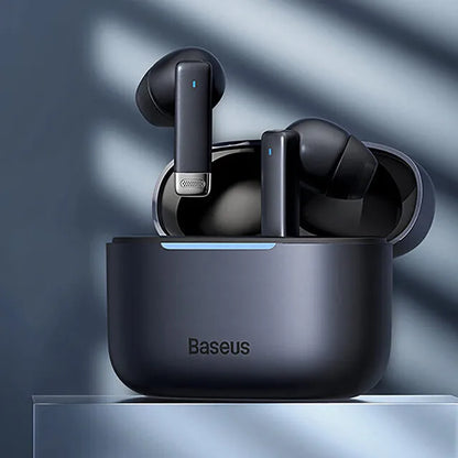 Pearl White and Obsidian Black true wireless earbuds with charging case on a table.