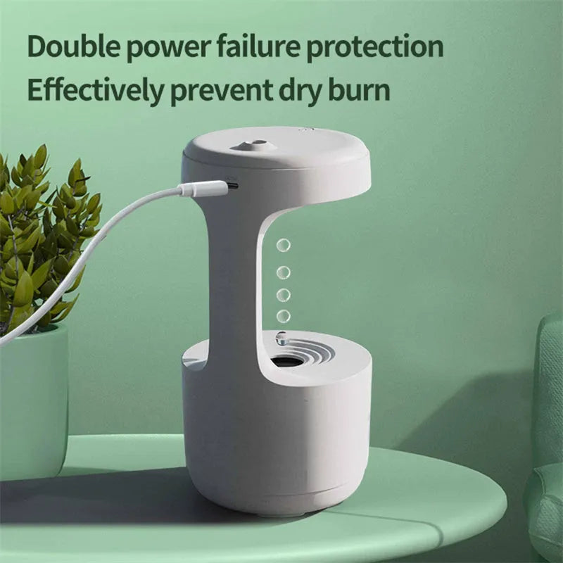 White columnar anti-gravity humidifier with water droplet backflow and LED clock display on a desk.