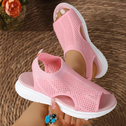 Women's black platform sports sandals with a flat toe and rubber sole on a light background