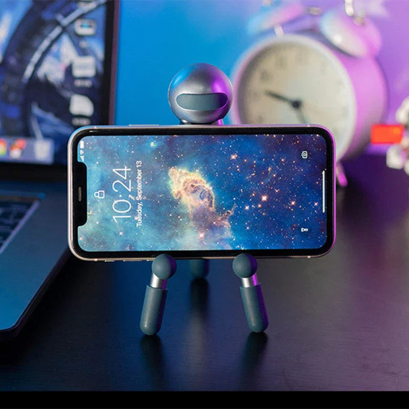 Adjustable desk stand in pink and green alien-inspired designs, featuring a mobile phone and tablet holder with 120-degree angle adjustment