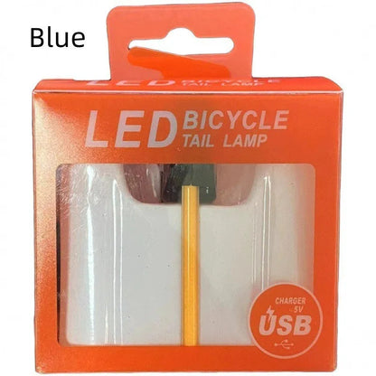 Waterproof USB rechargeable bicycle tail light in blue, pink, red, white, or yellow colours