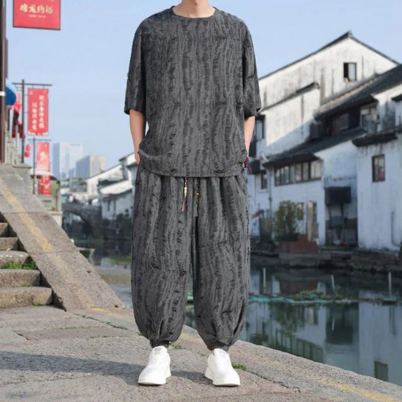 Men's thin short-sleeved two-piece suit trousers loose knitwear national style set in black or grey colour with cropped pants and half-sleeve top, available in sizes M to 5XL for weights 40kg to 110kg.