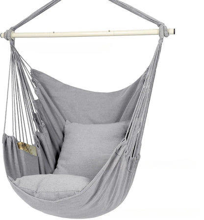 Folding outdoor tassel hammock in beige with canvas seat, cushion, and three-section iron pipe