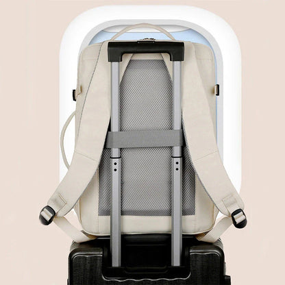 A stylish and high-capacity backpack with multiple pockets and zippers, designed for business and travel use.