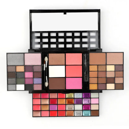 Open 74 colour makeup combination palette showing four layers of eyeshadow, lip gloss, blush and contour powders with brushes.