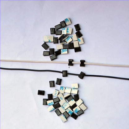 Black PA66 nylon car wire retaining clip for managing automotive and LED electronic cables.