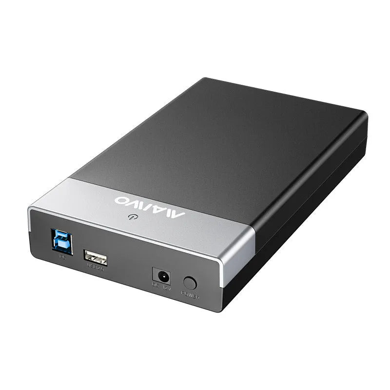 Black USB 3.0 SATA hard disk enclosure for 3.5-inch drives with slide cover open, showing connectors, alongside power supply and cable.