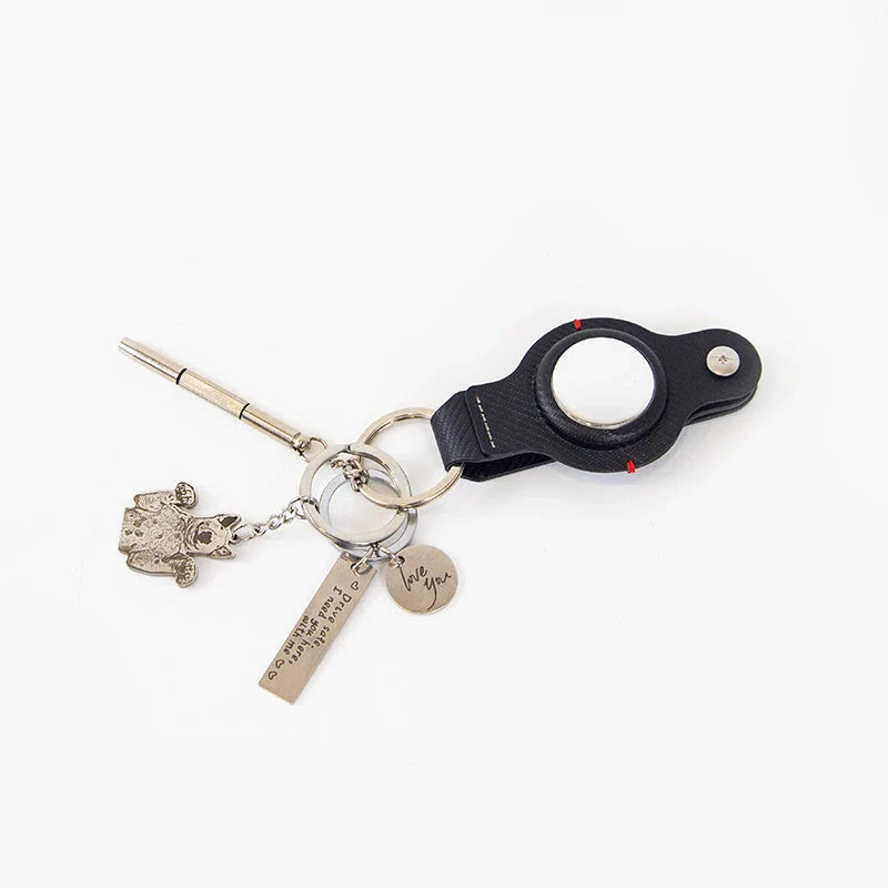 Premium PU leather AirTag keychain holder in black and grey colors for secure tracking of valuables