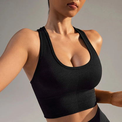 Black women's sports bra with fixed double shoulder straps and a full cup design on a mannequin.