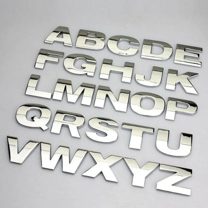 Metal zinc alloy car bumper sticker letters showing 3D design in black and silver finishes