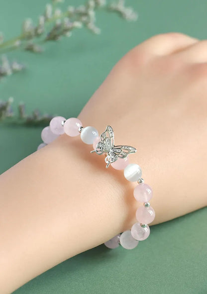 Women's crystal bow bracelet with butterfly design in ocean blue, pink, and purple colour options