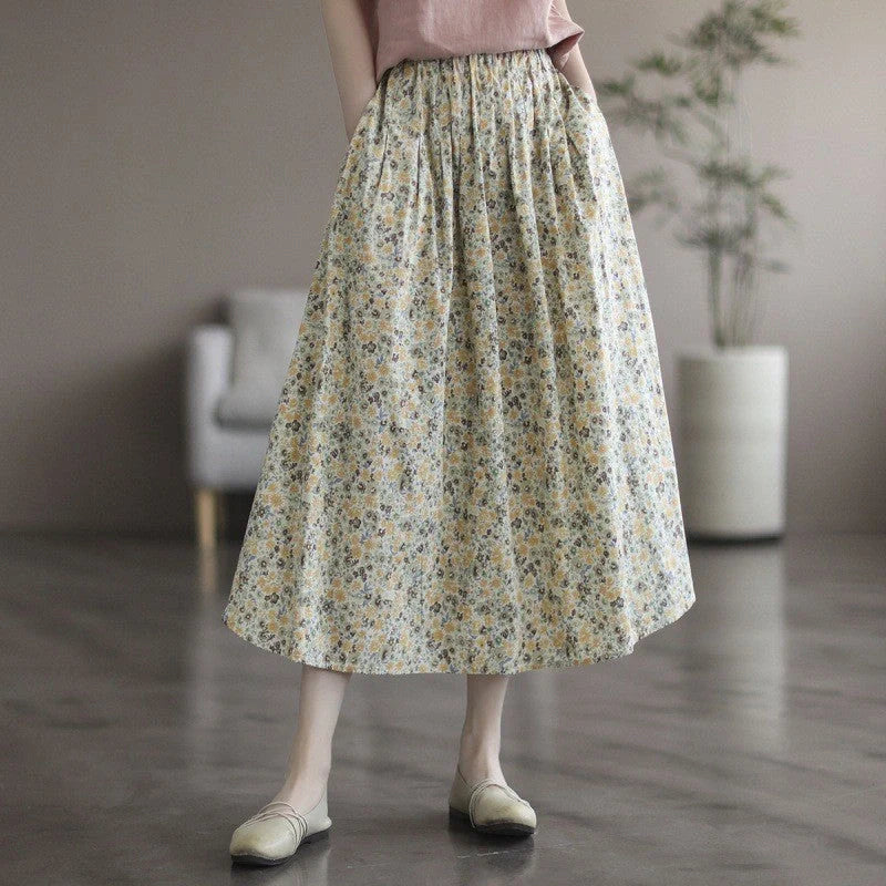 Elegant floral-printed cotton skirt with pleated design, available in yellow and blue flower patterns