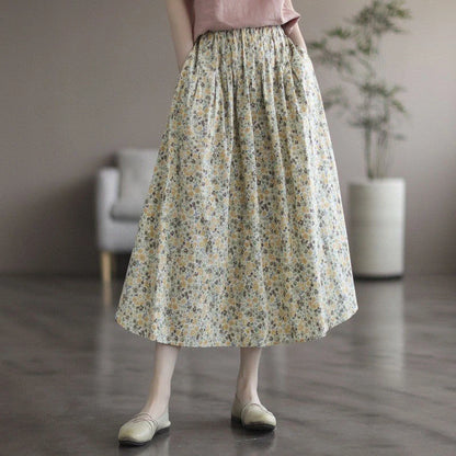 Elegant floral-printed cotton skirt with pleated design, available in yellow and blue flower patterns