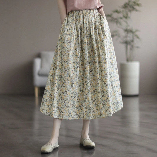 Elegant floral-printed cotton skirt with pleated design, available in yellow and blue flower patterns