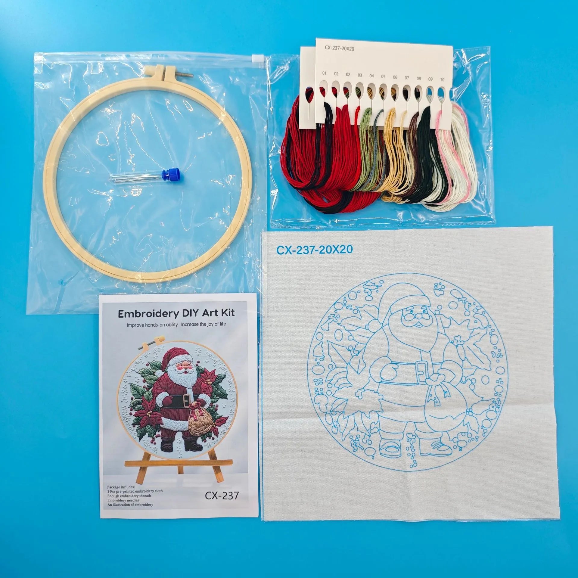 Santa Claus embroidery fabric kit showing 28x28cm cotton linen cloth with landscape pattern