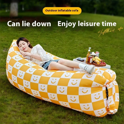Yellow smiling face pattern inflatable portable seat for outdoor use