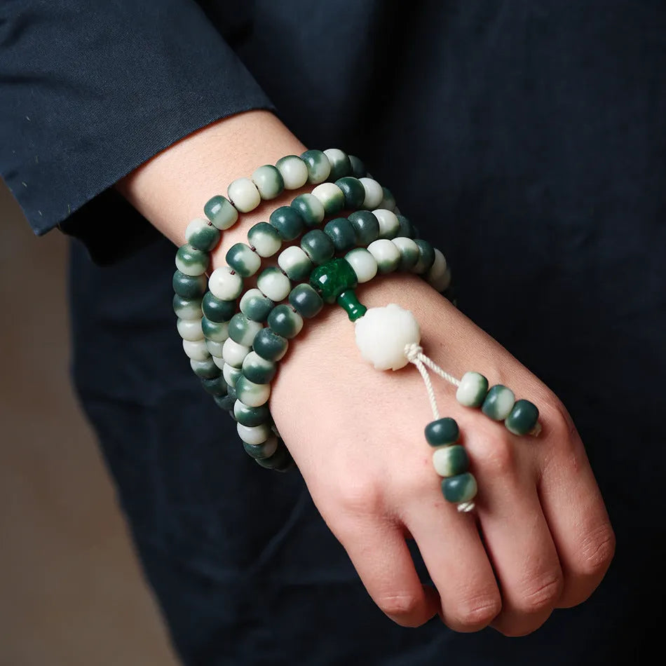 Lotus white jade Bodhi root bracelet with floating flowers pattern on 8x10mm beads
