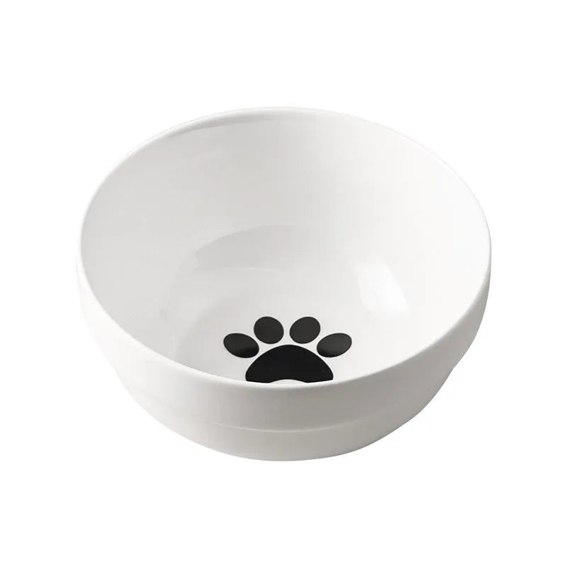 White ceramic pet bowl with cat paw print in a black iron stand with cat ear details