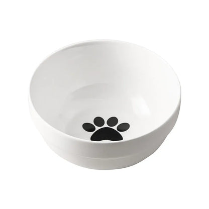 White ceramic pet bowl with cat paw print in a black iron stand with cat ear details