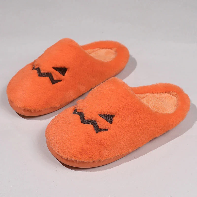 Cozy pumpkin-shaped slippers in orange color with plush fabric and non-slip sole for comfortable indoor wear