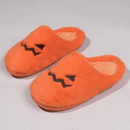 Cozy pumpkin-shaped slippers in orange color with plush fabric and non-slip sole for comfortable indoor wear