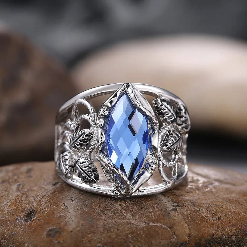 Blue horse eye-shaped crystal ring in alloy metal with geometric design on finger