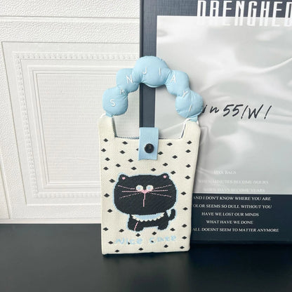 Cartoon knitted messenger bag with polyester construction and internal mobile phone storage