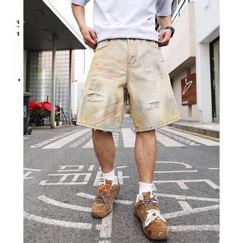 Men's light blue denim shorts with distressed finish and straight-leg silhouette