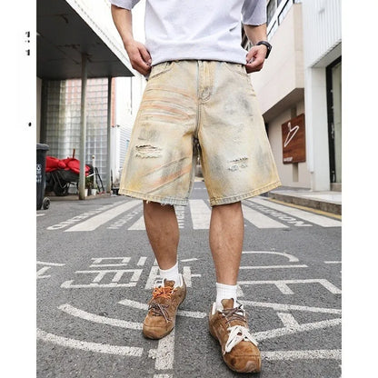 Men's light blue denim shorts with distressed finish and straight-leg silhouette