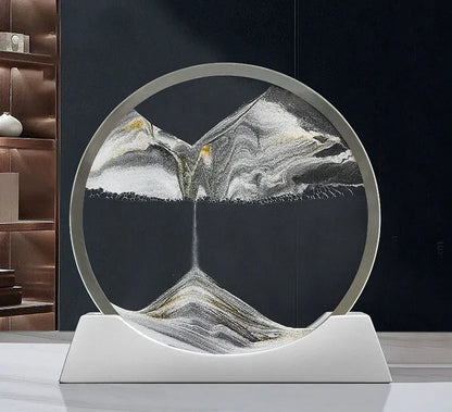 Modern abstract quicksand painting rotary night lamp in blue, 12 inches tall on a desktop.